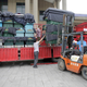 A forklift unloads a truck of coffins at a mortuary after a cruise ship sank on the Yangtze River in Jianli, Hubei province, China, June 3, 2015.